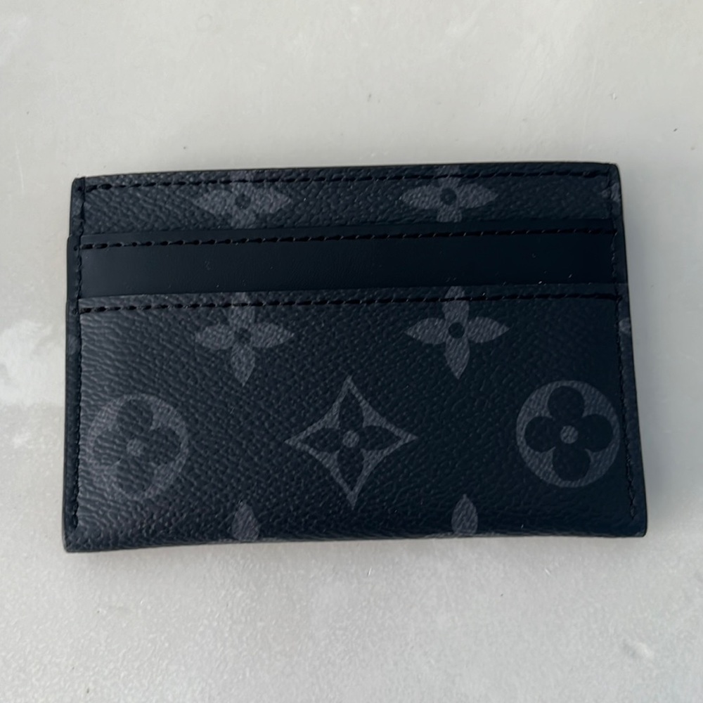 Louis Vuitton black card wallet, new barely used